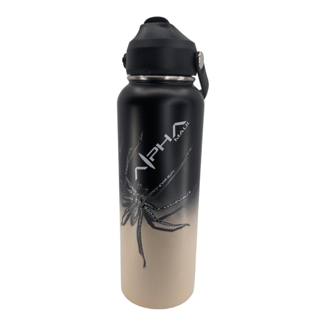 The Daddy Cane Thermo is a stainless steel water bottle with a stunning black-to-beige gradient design, adorned with an intricate black octopus graphic on the front. It features a black lid with a handle and is branded as "Alpha Maui," making it the perfect addition to your beach apparel for those sunny Hawaii days.