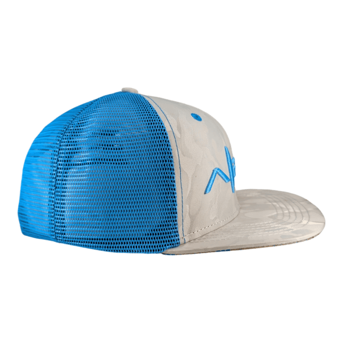 A side view of "The Chillee" baseball cap showcases a structured design with a blue mesh back and a light gray front panel adorned with a blue embroidered logo. The brim is light gray with a subtle pattern.