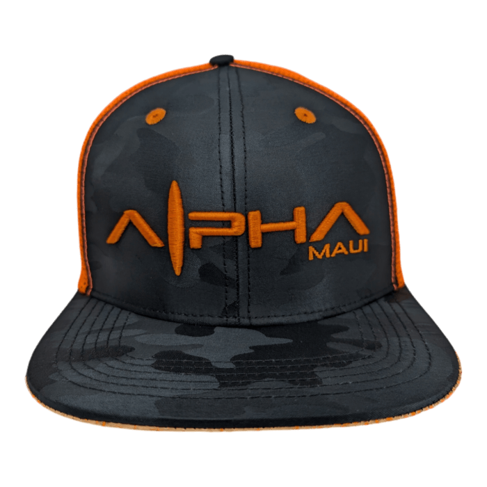 A black camouflage-patterned baseball cap, named the Lava Loaded, with orange embroidered text reading "ALPHA MAUI" on the front. The cap features an orange border around the brim and stitching along the seams.