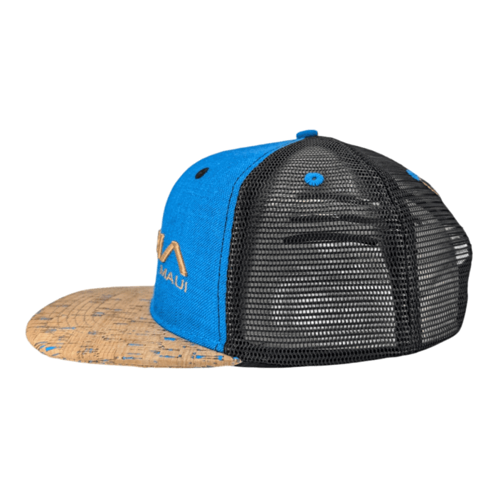 Introducing The Coastline: a blue and black trucker hat with a cork-patterned bill and mesh back, featuring a front panel in blue with yellow stitching of the "MAUI" logo alongside a stylized mountain peak.