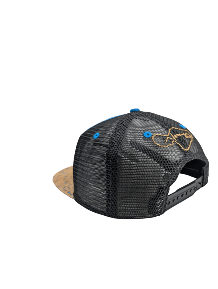 The Coastline snapback cap is displayed from the rear, showcasing its black mesh design with a tan brim and blue accents. The back panel features an embroidered yellow fish outline.