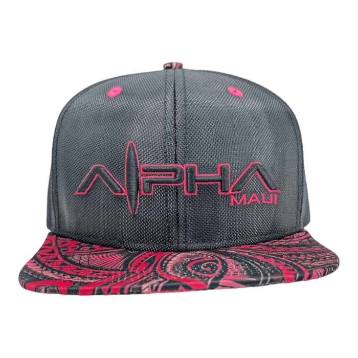 A snapback hat named "Tribal Wai" featuring a dark gray cap contrasted by a vibrant red and black patterned brim. The front showcases the word "ALPHA" in large, stylized red letters with "MAUI" in smaller red letters on the right side, boasting a tech-inspired design.