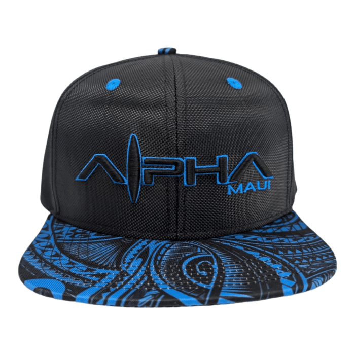 A black snapback hat named "Tribal Wai" with blue embroidery displaying the words "Alpha" and "Maui," featuring a brim adorned with intricate blue and black patterns.