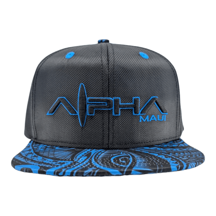 A "Tribal Wai" black baseball cap featuring blue embroidery with "Alpha Maui" on the front. The brim showcases an intricate blue and black abstract swirl pattern, with the top eyelets also in blue, matching the embroidery and brim design.