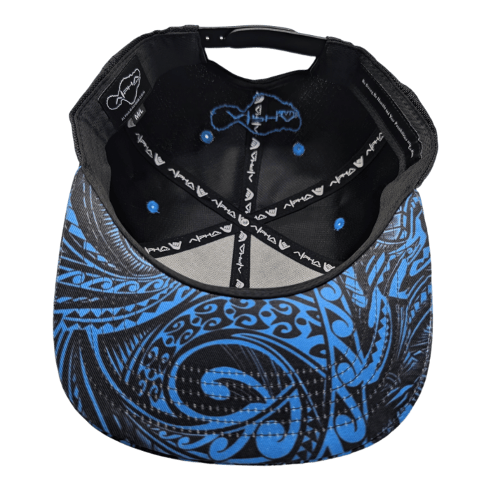 The Tribal Wai cap is displayed upside down, showcasing its interior. It features intricate blue tribal patterns on the bill and underside of the top. The inner headband displays branding text, while blue stitching accents the black fabric.