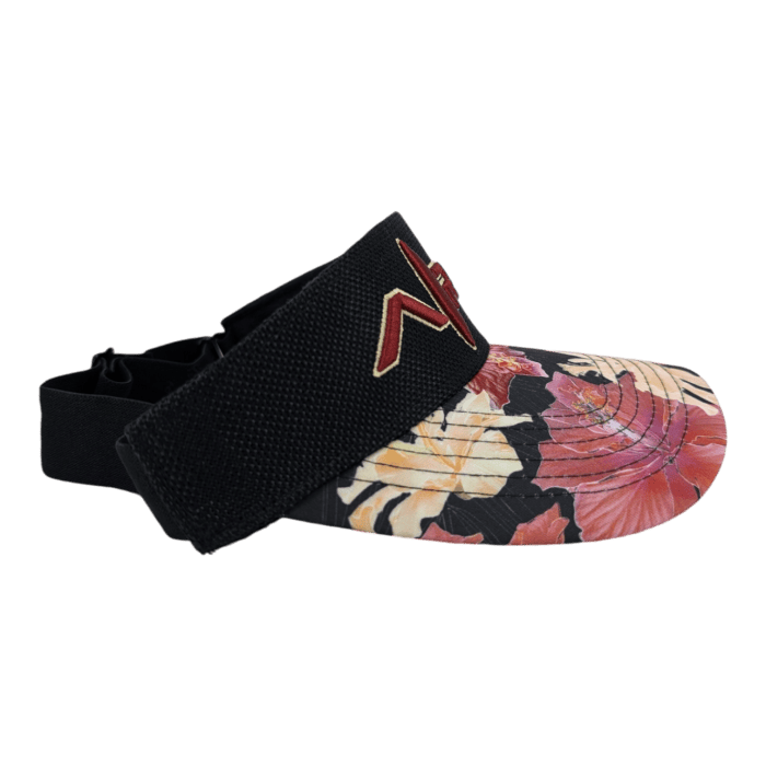 The Drop Top Hibiscus visor features a wide black strap adorned with a prominent red "N". The cap portion showcases an eye-catching tropical floral design in vibrant shades of pink, red, orange, and green set against a black background.