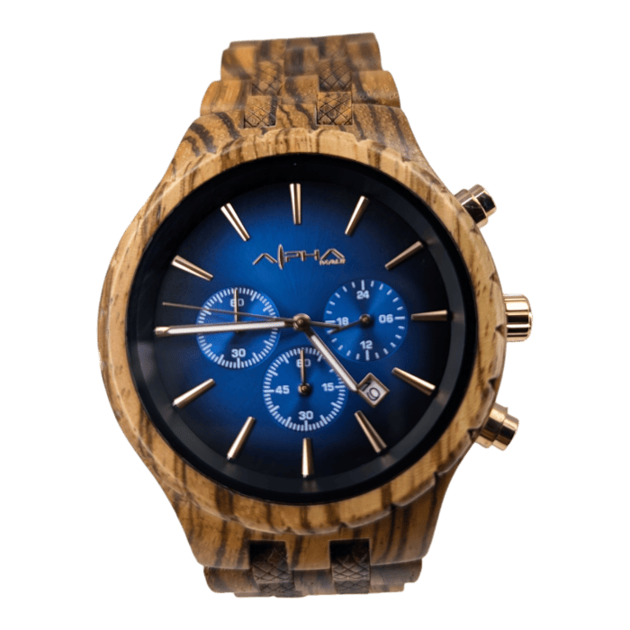 The Voyger, a wooden wristwatch with a blue dial, features three small sub-dials, gold-tone hands and indices. The band and case showcase a natural wood grain pattern, with the brand name "Alpha" located just below the 12 o'clock position.