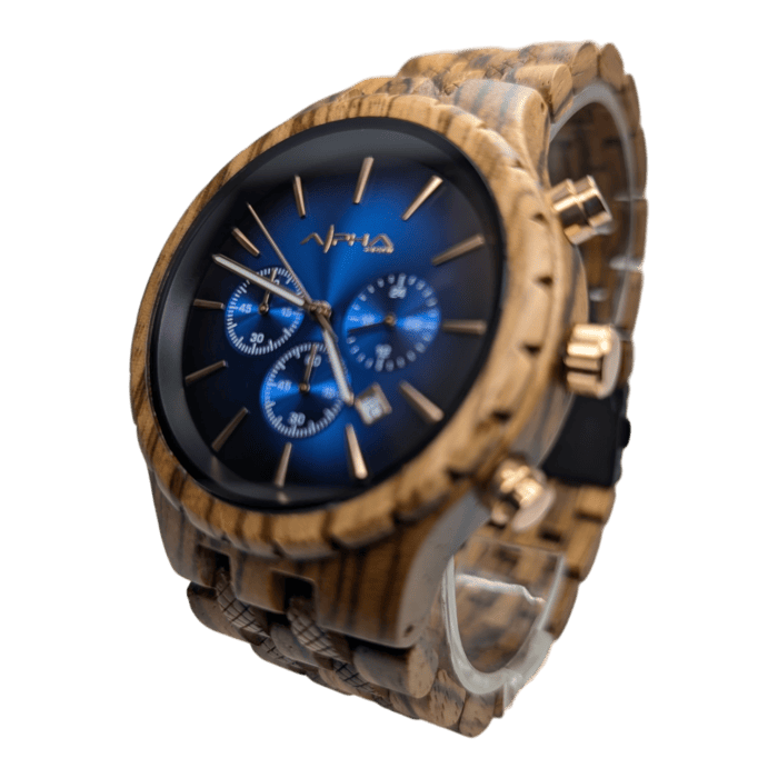 Introducing The Voyager: a wristwatch featuring a wooden band and casing. Its blue watch face is accentuated by gold hour markers, three subdials, and a date window. The gold watch hands complement the design beautifully, with the brand name "Alpha" proudly displayed at the top of the face.