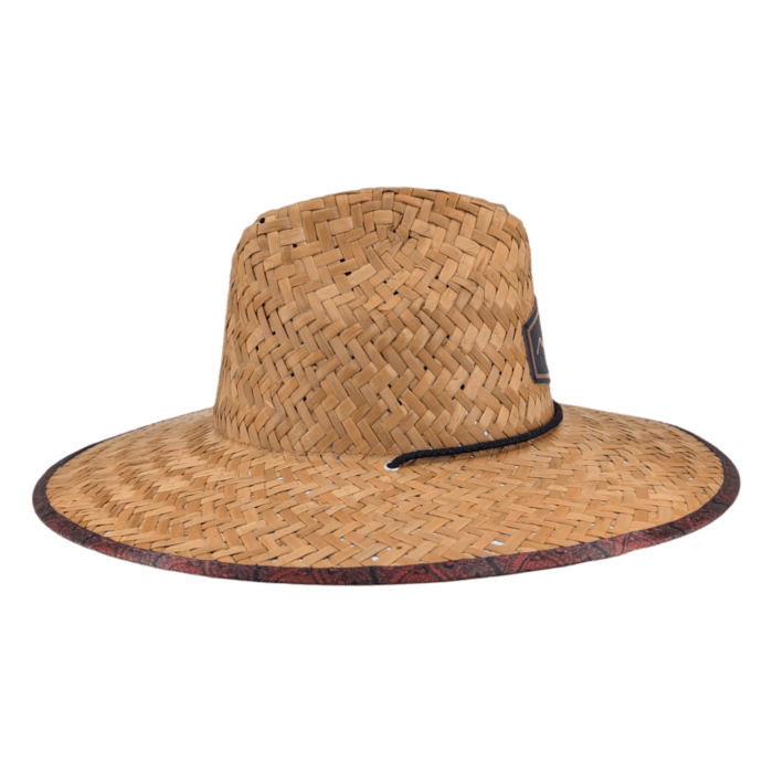 The Autumn Sunrise is a wide-brimmed straw hat with a woven pattern. It features a stylish black patch on the front and has a dark patterned trim along the edge of the brim. The hat is showcased against a plain black background.