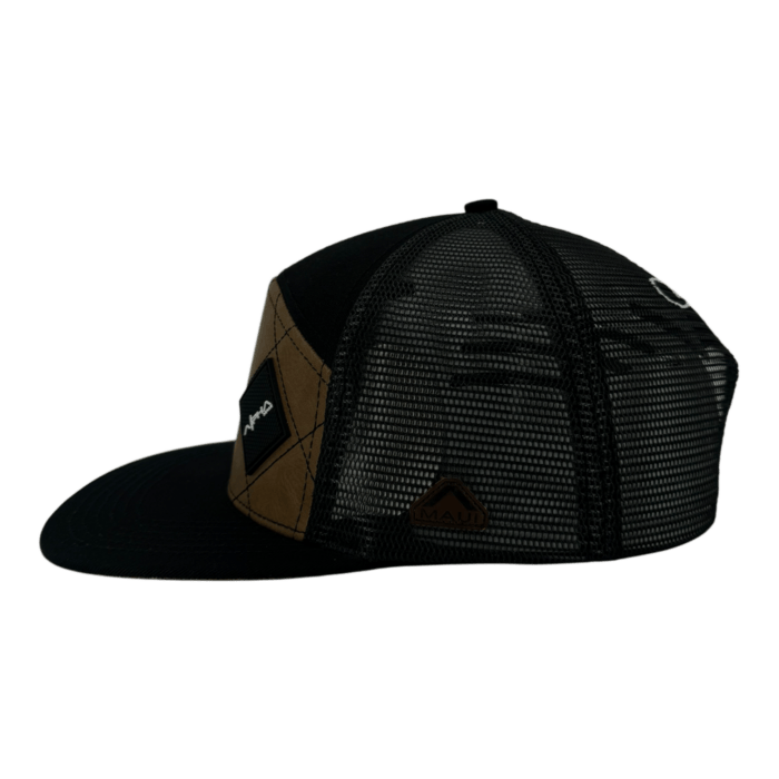 Side view of a black and brown trucker hat with mesh detailing and a curved brim. The front features a small patch with a logo.